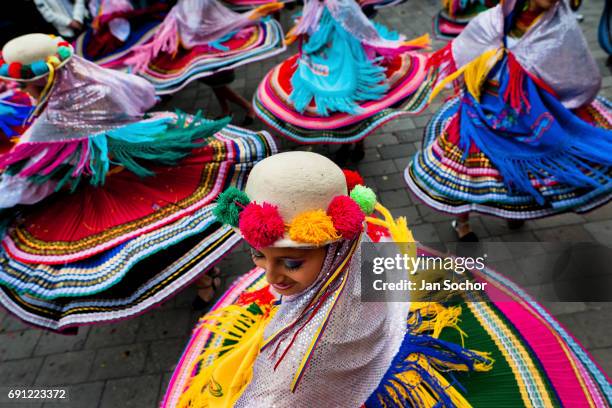 Women dancers perform in the religious parade within the Corpus Christi festival in Pujili on June 01, 2013 in Pujili, Ecuador. Every year in June,...