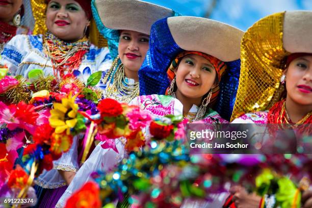 Women dancers perform in the religious parade within the Corpus Christi festival in Pujili on June 01, 2013 in Pujili, Ecuador. Every year in June,...