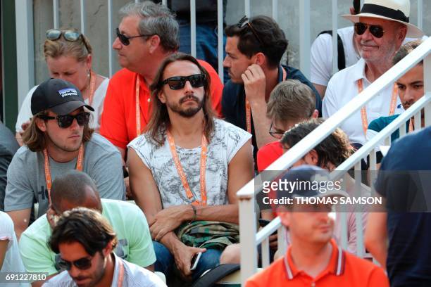 French Disc Jockey Christophe Le Friant aka Bob Sinclar attends a tennis match during the Roland Garros 2017 French Open on June 1, 2017 in Paris. /...