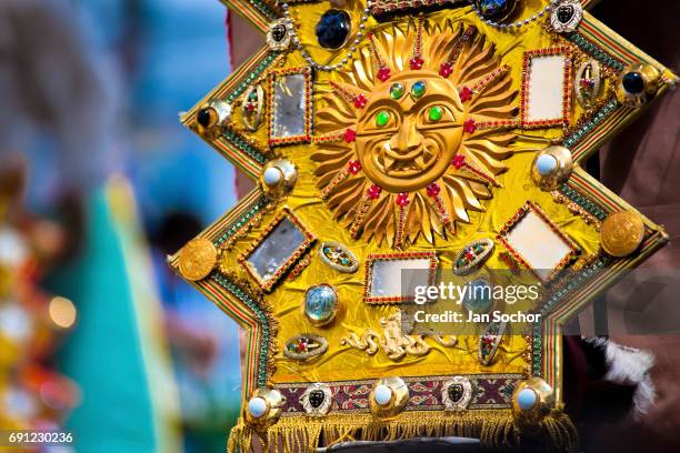 Symbol of the sun seen on a costume during the religious parade within the Corpus Christi festival in Pujili on June 01, 2013 in Pujili, Ecuador....