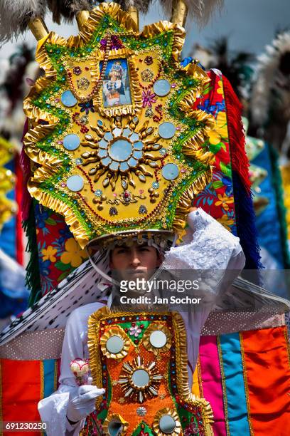 Dancer performs during the religious parade within the Corpus Christi festival in Pujili on June 01, 2013 in Pujili, Ecuador. Every year in June,...