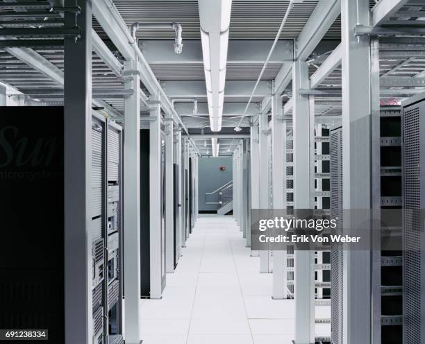 interior shot of server room hallway - network server stock pictures, royalty-free photos & images