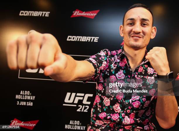 Featherweight interim champion Max Holloway of the United States pose for photographers during Ultimate Media Day at Windsor Hotel on June 01, 2017...