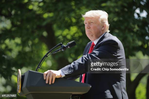 President Donald Trump announces his decision to pull the United States out of the Paris climate agreement in the Rose Garden at the White House June...
