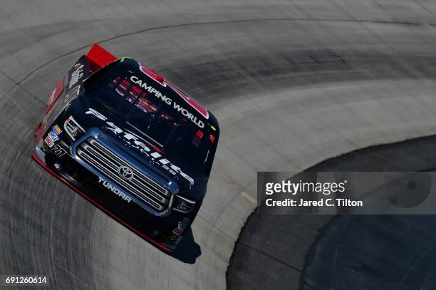 Ben Rhodes, driver of the Safelite Auto Glass Toyota, practices for the NASCAR Camping World Truck Series Bar Harbor 200 presented by Sea Watch...