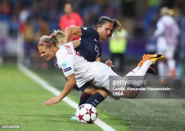 Eugenie Le Sommer of Olympique Lyonnais is challenged by Eve Perisset of Paris Saint-Germain Feminines during the UEFA Women's Champions League Final...
