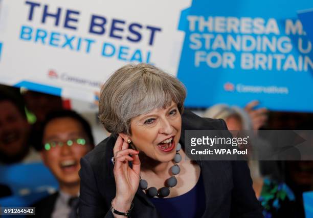 Britain's Prime Minister Theresa May reacts as she speaks at an election campaign event at Pride Park Stadium on June 1, 2017 in Derby, United...