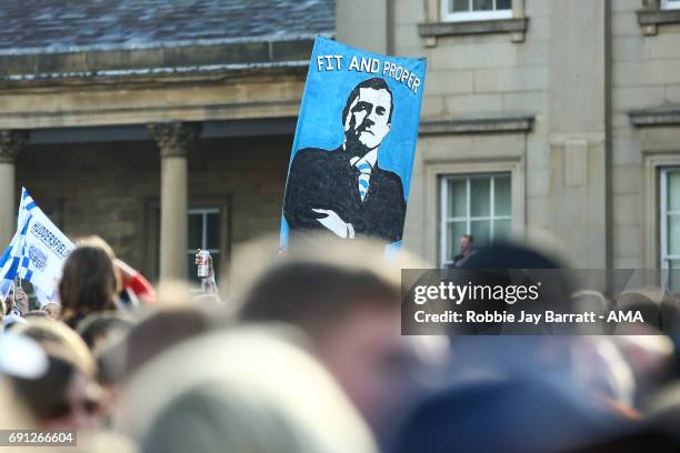 Huddersfield town fans hold up a flag of Dean Hoyle Chairman / owner of Huddersfield Town on May 30, 2017 in Huddersfield, England. Dean Hoyle