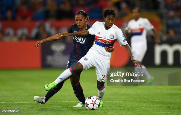 Kadeisha Buchanan of Olympique Lyonnais and Marie-Laure Delie of Paris Saint-Germain Feminines battle for the ball during the UEFA Women's Champions...