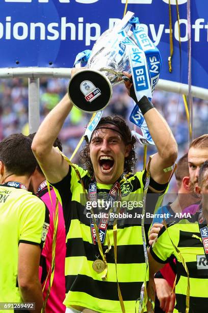 Michael Hefele of Huddersfield Town lifts the Sky Bet Championship play offs trophy during the Sky Bet Championship Play Off Final match between...