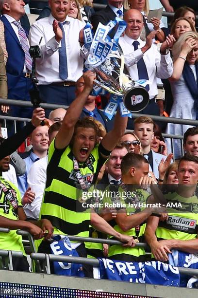 Michael Hefele of Huddersfield Town lifts the Sky Bet Championship play offs trophy during the Sky Bet Championship Play Off Final match between...