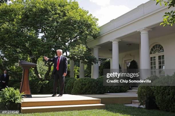 President Donald Trump walks away from the podium after announcing his decision to pull the United States out of the Paris climate agreement in the...