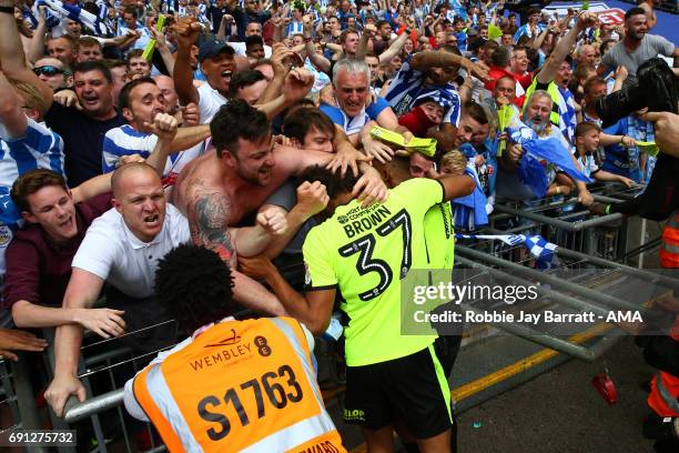 Isaiah Brown of Huddersfield Town celebrates with the Huddersfield Town fans during the Sky Bet Championship Play Off Final match between Reading and...