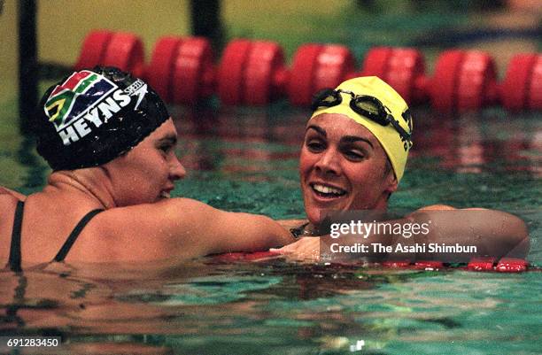 Samantha Riley of Australia celebrates winning the Women's 100m Breaststroke with second place Penelope Heyns of South Africa during day two of the...