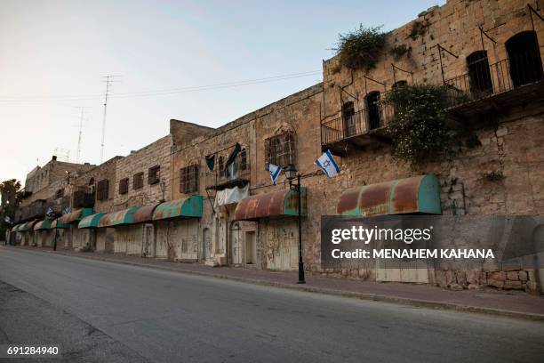 Picture taken on May 29, 2017 show the Shuhada Street, which used to be a large Palestinian market, in the divided West Bank city of Hebron. After...