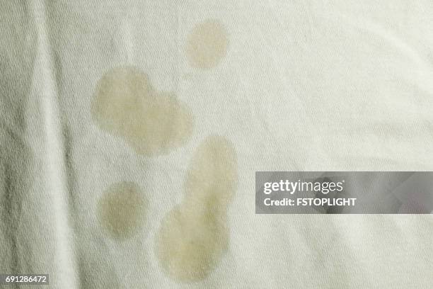 oil stain on white cloth - stains imagens e fotografias de stock