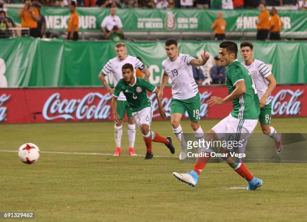 Raul Jimenez of Mexico scores the second goal of his team during the friendly match between the Republic of Ireland and Mexico at MetLife Stadium on...