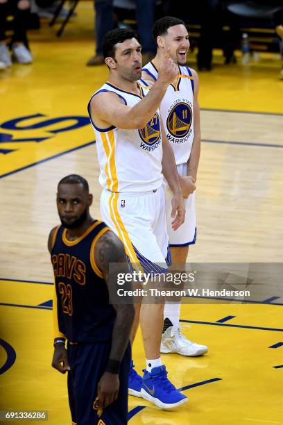 Zaza Pachulia and Klay Thompson of the Golden State Warriors reacts to a play against the Cleveland Cavaliers in Game 1 of the 2017 NBA Finals at...