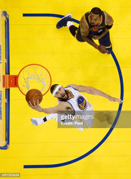 JaVale McGee of the Golden State Warriors dunks the ball against JR Smith of the Cleveland Cavaliers in Game 1 of the 2017 NBA Finals at ORACLE Arena...
