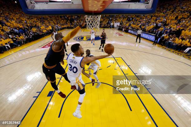 Stephen Curry of the Golden State Warriors throws up a shot against LeBron James of the Cleveland Cavaliers in Game 1 of the 2017 NBA Finals at...