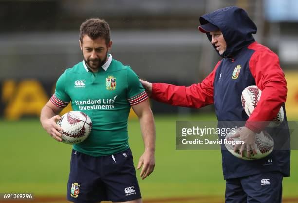 Greig Laidlaw receives instructions from kicking coach Neil Jenkins during the British & Irish Lions training session at Toll Stadium on June 2, 2017...