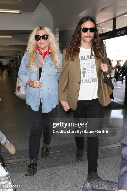 Kesha and Brad Ashenfelter are seen at LAX on June 01, 2017 in Los Angeles, California.