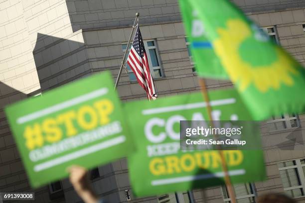 Members of the German Greens Party protest outside the U.S. Embassy against the announcement by U.S. President Donald Trump the day before that he...