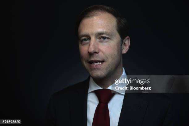 Denis Manturov, Russia's trade and industry minister, poses for a photograph during the St. Petersburg International Economic Forum at the Expoforum...