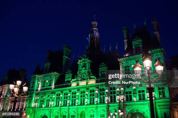 The Paris city hall on 1 June, 2017 is lightened in green « to mark the disapprobation » of the french capital and its socialist mayor Anne Hidalgo...