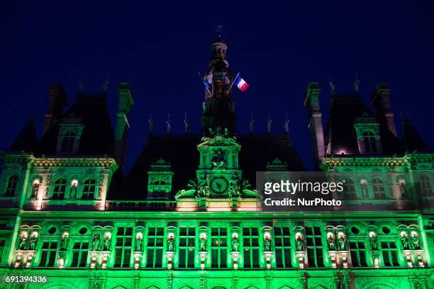 The Paris city hall on 1 June, 2017 is lightened in green « to mark the disapprobation » of the french capital and its socialist mayor Anne Hidalgo...