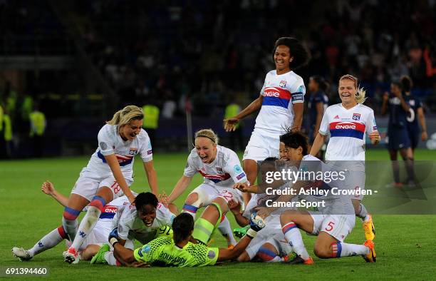 Olympique Lyonnais players celebrate winning the game after Sarah Bouhaddi scores the winning penalty during the UEFA Women's Champions League Final...
