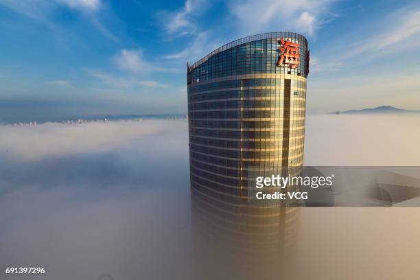 Advection fog surrounds buildings on June 2, 2017 in Rizhao, Shandong Province of China.