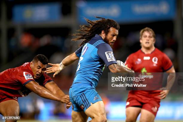 Rene Ranger of the Blues heads in for the opening try during the round 15 Super Rugby match between the Blues and the Reds at Apia Park National...