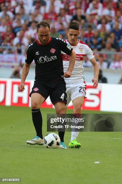 Rico Benatelli of Wuerzburger Kickers and Josip Brekalo of Stuttgart battle for the ball during the Second Bundesliga match between VfB Stuttgart and...