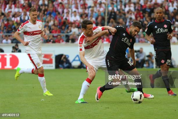 Christian Gentner of Stuttgart and Neijmeddin Daghfous of Wuerzburger Kickers battle for the ball during the Second Bundesliga match between VfB...