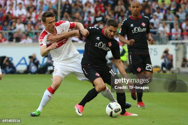 Christian Gentner of Stuttgart and Neijmeddin Daghfous of Wuerzburger Kickers battle for the ball during the Second Bundesliga match between VfB...