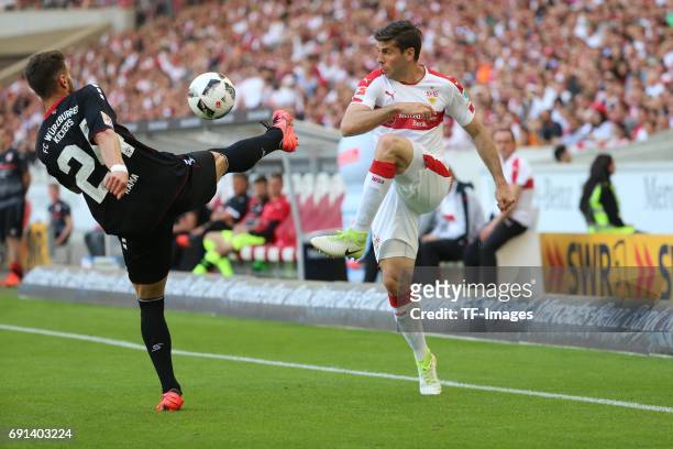 Valdet Rama of Wuerzburger Kickers and Emiliano Adrian Insua Zapata of Stuttgart battle for the ball during the Second Bundesliga match between VfB...
