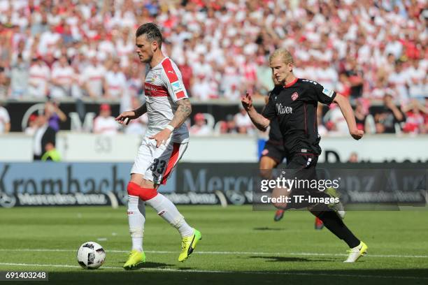 Daniel Gincek of Stuttgart and Clemens Schoppenhauer of Wuerzburger Kickers battle for the ball during the Second Bundesliga match between VfB...