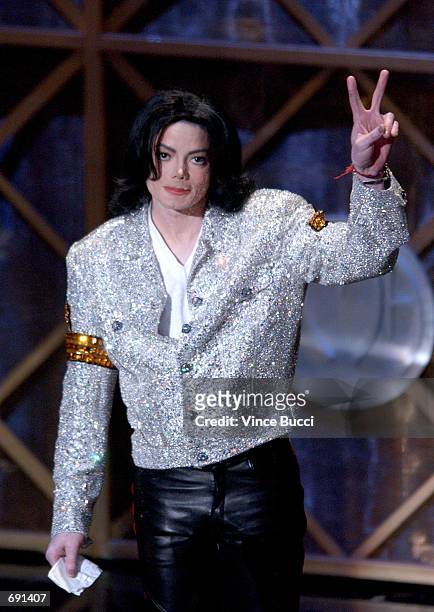 Singer Michael Jackson accepts his Peformer of the Century Award during the 29th Annual American Music Awards at the Shrine Auditorium January 9,...
