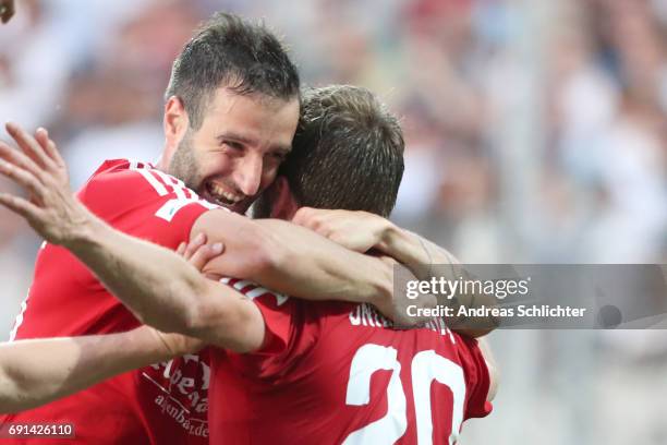 Maximilian Nicu celebrate with Dominik Stahl of Unteraching during the Third League Playoff leg two match between SV Elversberg and SpVgg...