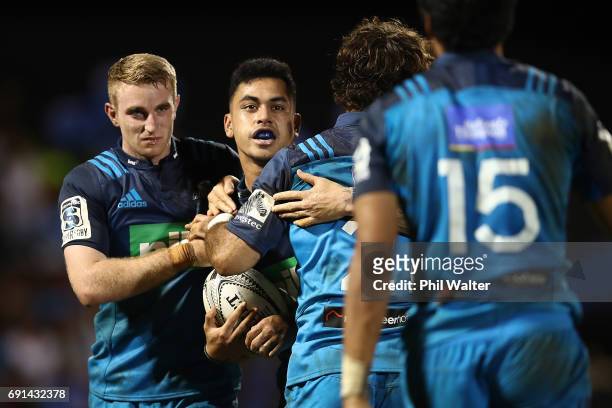 Stephen Perofeta of the Blues celebrates his try during the round 15 Super Rugby match between the Blues and the Reds at Apia Park National Stadium...