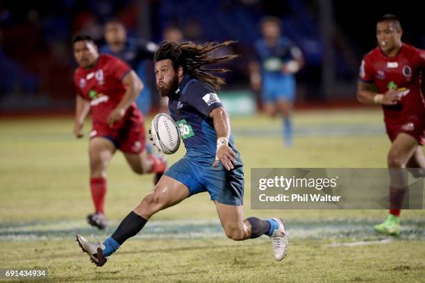 Rene Ranger of the Blues breaks away during the round 15 Super Rugby match between the Blues and the Reds at Apia Park National Stadium on June 2,...