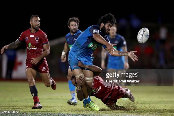 Akira Ioane of the Blues is tackled during the round 15 Super Rugby match between the Blues and the Reds at Apia Park National Stadium on June 2,...
