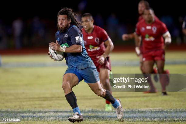 Rene Ranger of the Blues breaks away during the round 15 Super Rugby match between the Blues and the Reds at Apia Park National Stadium on June 2,...