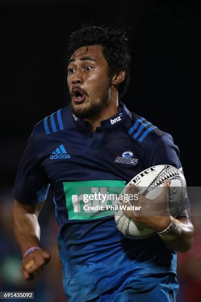 Melani Nanai of the Blues breaks away during the round 15 Super Rugby match between the Blues and the Reds at Apia Park National Stadium on June 2,...