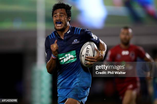 Melani Nanai of the Blues breaks away during the round 15 Super Rugby match between the Blues and the Reds at Apia Park National Stadium on June 2,...