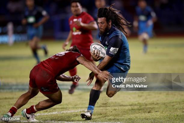 Rene Ranger of the Blues breaks away during the round 15 Super Rugby match between the Blues and the Reds at Apia Park National Stadium on June 2,...