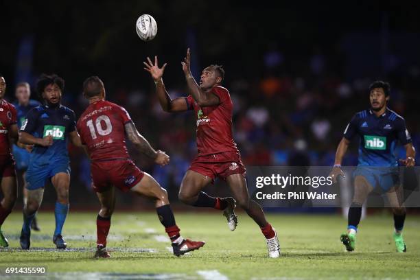 Chris Kuridrani of the Reds collects the loose ball during the round 15 Super Rugby match between the Blues and the Reds at Apia Park National...