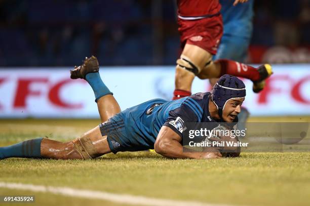 Gerard Cowley-Tuioti of the Blues scores a try during the round 15 Super Rugby match between the Blues and the Reds at Apia Park National Stadium on...
