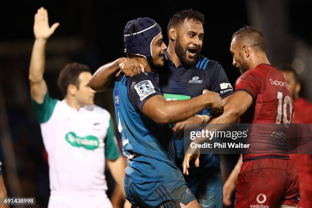 Gerard Cowley-Tuioti of the Blues celebrates his try with Patrick Tuipulotu during the round 15 Super Rugby match between the Blues and the Reds at...